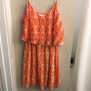 Orange and white flowy summer dress.